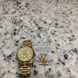 MK oversized gold tone watch